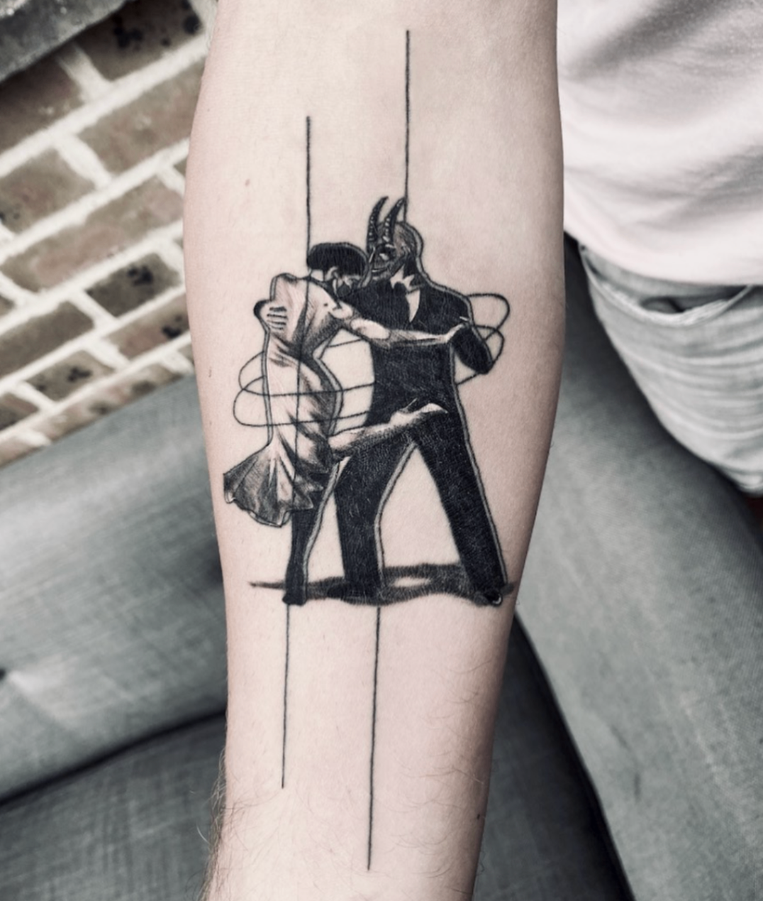 Abstract dancing couple with horned figure