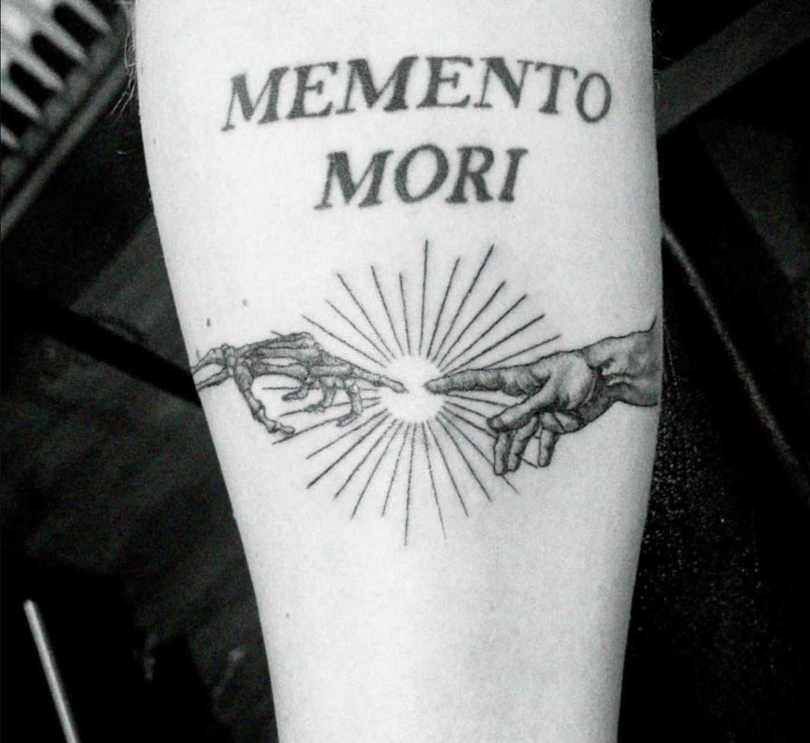 Memento mori tattoo with skeleton and human hands