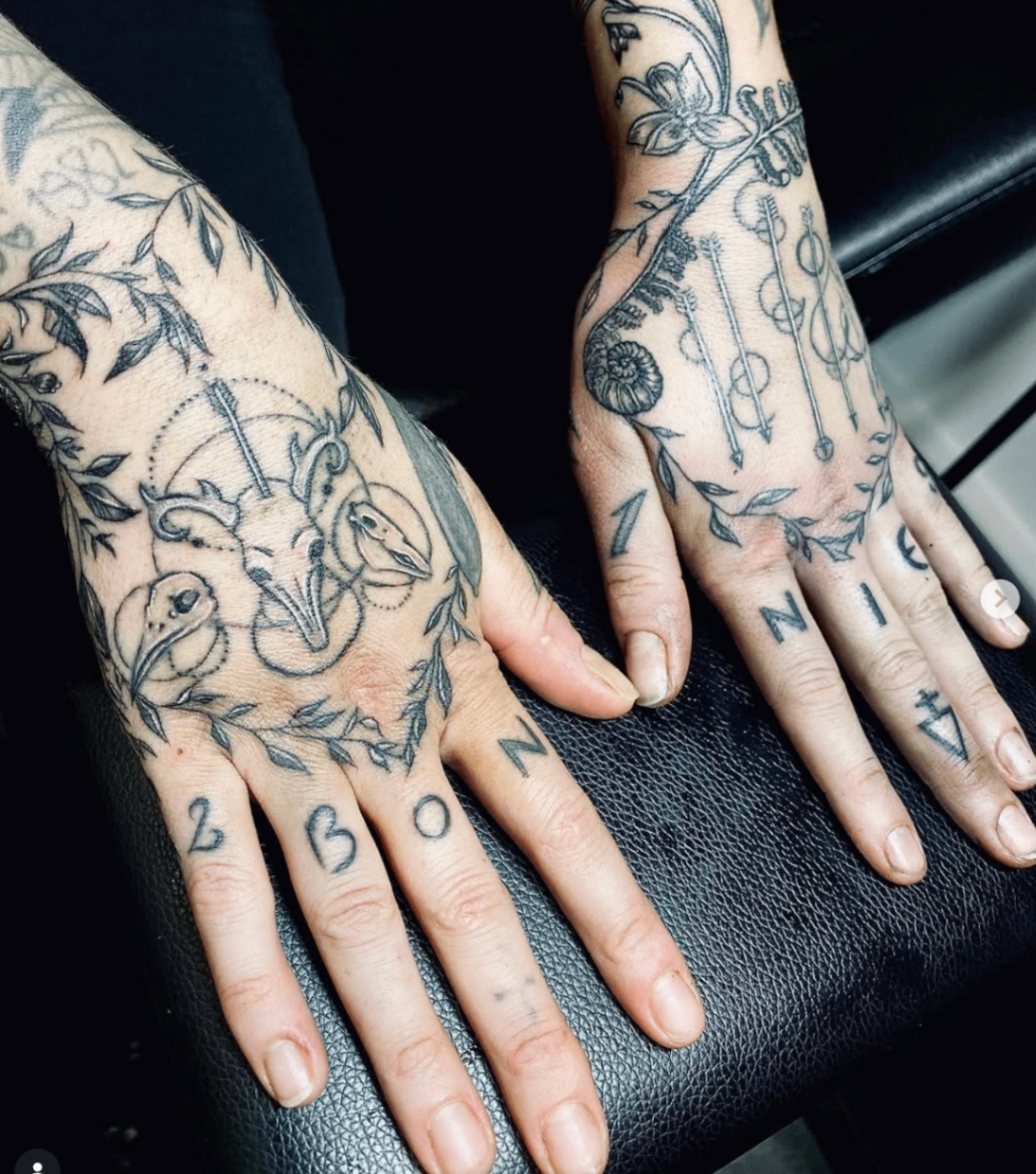 Fine-line hand tattoo set with botanical and geometric details