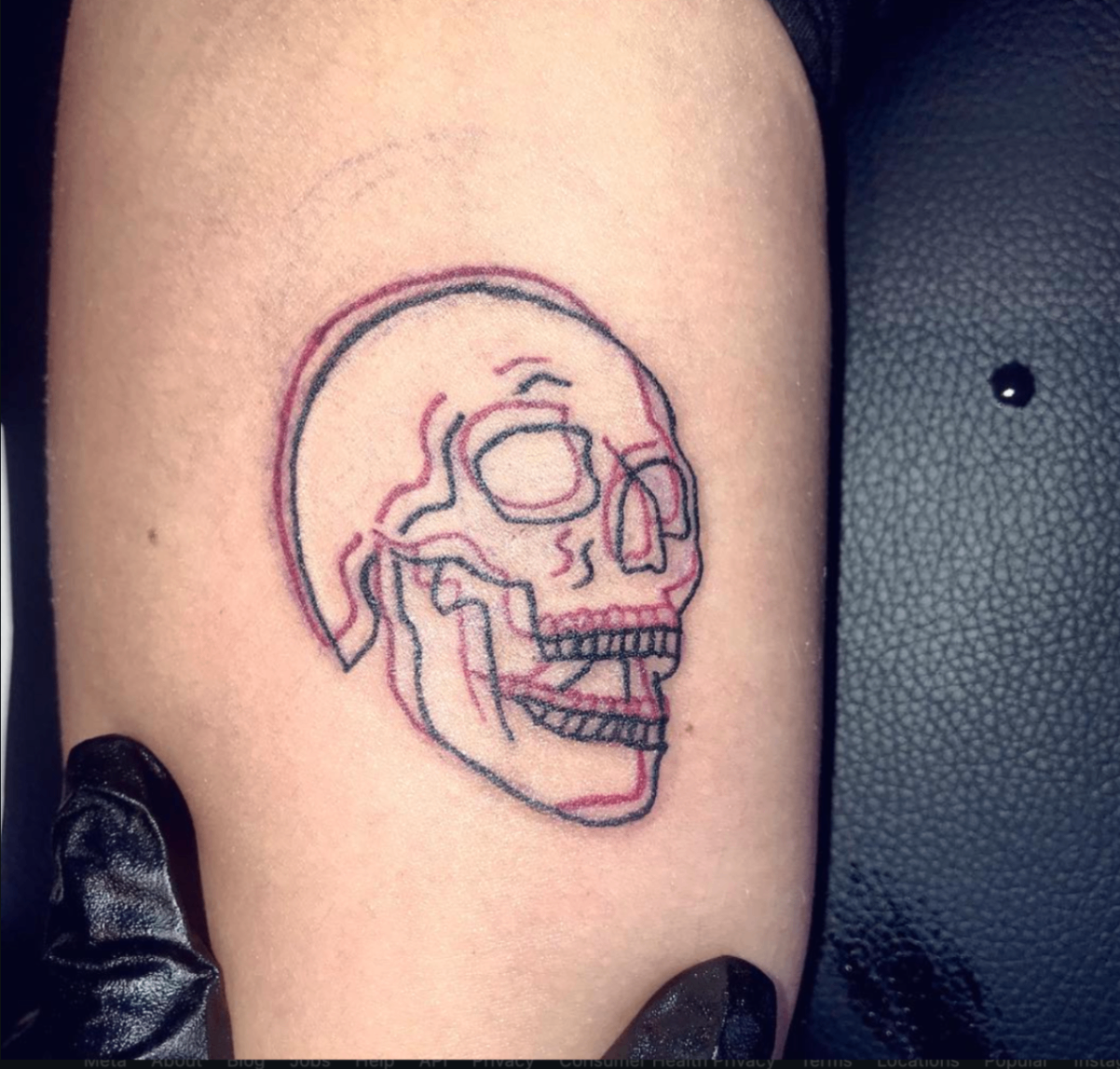 Double-exposure red and black line skull